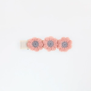 Detail of three-flower embroidered hair clip in pink and grey with rib ribbon wrap