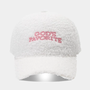 Close-up of God's Favorite embroidery on cream teddy fleece baseball cap