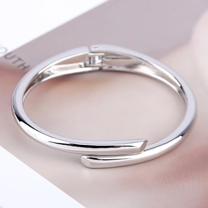 Minimalist silver polished stainless steel open bangle with sleek linear design
