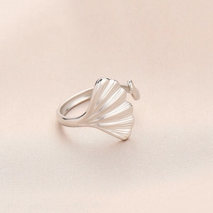 Elegant gold plated stainless steel ginkgo leaf open ring on pink silk background
