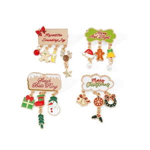 Set of four festive Christmas enamel pins with holiday bells and pendants on white background
