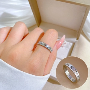 Minimalist silver titanium steel ring with Roman numeral engravings and small diamonds