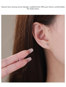 Detail view of S999 sterling silver stud earrings with colorful four-claw cubic zirconia