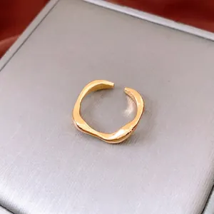 Minimalist 18k gold plated irregular wave open ring with a polished metallic finish
