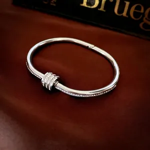Silver stainless steel open bangle with sliding pavé zircon rings in luxury design