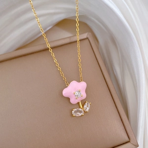 Elegant gold titanium necklace with pink enamel flower pendant and sparkling zircons