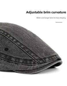 Detail of washed grey beret featuring a foldable wide brim for face contouring