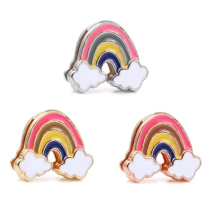 Detail view of colorful enamel rainbow charms with gold and silver metal edges