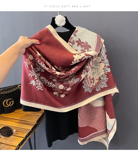 Close-up of soft burgundy and beige floral cashmere scarf with elegant flower pattern