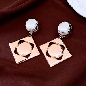 Chic two-tone geometric drop earrings with silver hemisphere and rose gold square charm