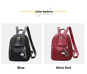 Detail of waterproof oxford fabric backpacks with gold hardware and bear charms