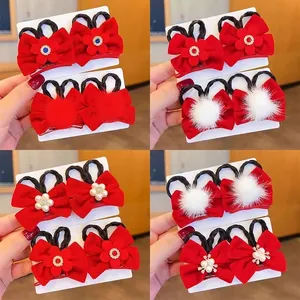 Red bow hair clips for girls with pearls, daisies, and braids for New Year hair styling