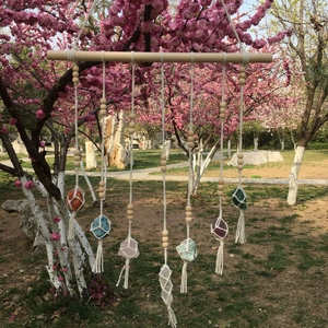 Handmade bohemian wall hanging with seven natural raw crystals on woven cotton rope