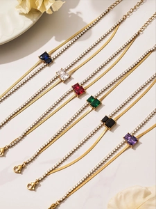 Detail of double-layer gold bracelets with square cut zircons in six different colors
