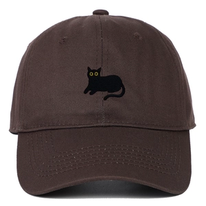 Detailed close-up of a sitting black cat embroidery on a brown cotton baseball cap