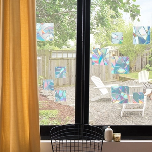 Rainbow prism window film stickers showing holographic light refraction on glass surfaces