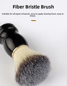 Close-up of shaving brush with gradient fiber bristles and matte black ergonomic handle