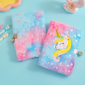 Detailed view of plush unicorn diary with silver foil star sequins and metal lock set