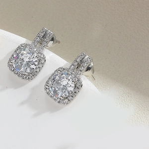 Close-up of square zircon stud earrings with silver plating and micro-pave crystals