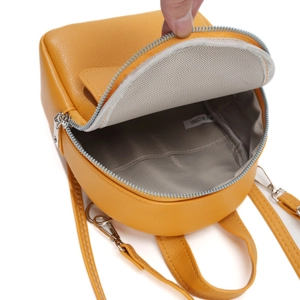 Mini yellow lychee leather backpack for women with grey herringbone lining interior view
