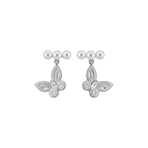Elegant silver-tone butterfly stud earrings with white pearls and sparkling crystals.