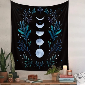 Bohemian black moon phase tapestry with blue botanical leaves for wall decoration