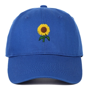 Close-up of sunflower embroidery detail on bright royal blue cotton baseball cap