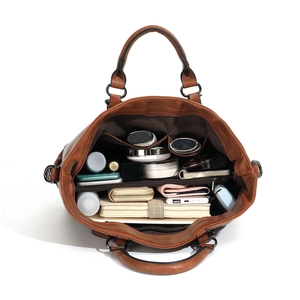 Brown vintage faux leather tote bag showing large capacity interior and pockets