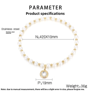 Macro shot of French style pearl necklace with gold beads and sparkling zircon pendant