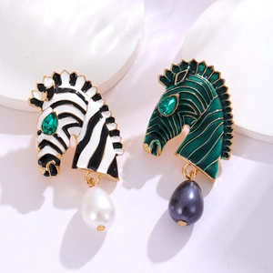 Elegant zebra head earrings with enamel stripes and hanging pearls in a professional view