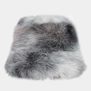 Detailed view of grey and white tie-dye faux fur bucket hat with fluffy winter texture