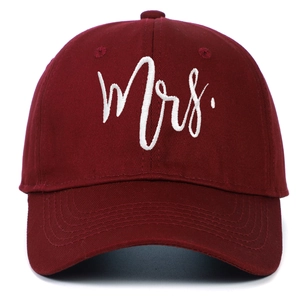 Dark red cotton baseball cap with white Mrs. embroidery, front view on white background