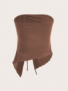 Close-up detail of the coffee brown waffle knit texture and side drawstring slit on the top