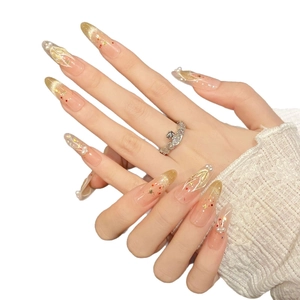 Golden glitter stiletto press-on nails with white pearls and hand-painted fishtail art