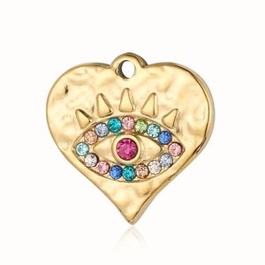 Close-up of golden heart pendant with colorful evil eye gemstone inlay on white background