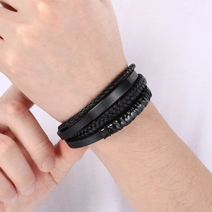 Men's multi-layer black braided leather bracelet with matte metal buckle on wrist
