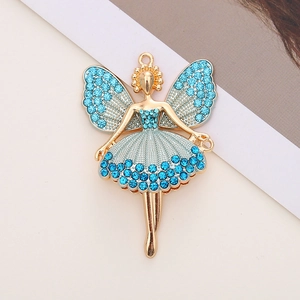 Macro detail of ballerina fairy charm featuring gold finish and blue crystal accents