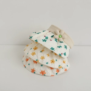 Detail of floral pattern quilting and 3D plush flower on children sun visor hat