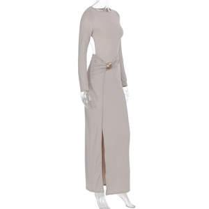 Detail of grey slim fit dress featuring waist ruching with gold metal rings and a side slit