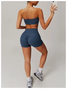Detail of high-waisted yoga shorts with scrunch butt design in elegant grey blue