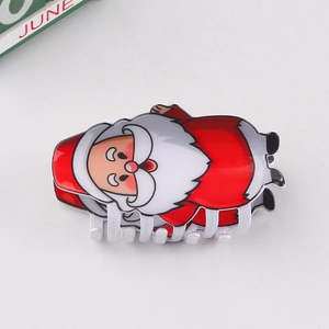 Vue de dessus d'une pince à cheveux Père Noël rouge et blanc en plastique poli