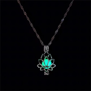 Luminous lotus locket necklace with glowing green bead on elegant silver chain