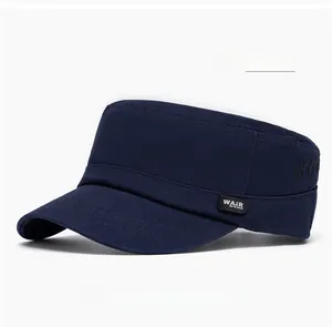 Macro shot of navy blue flat cap detail with side logo label and precise stitching