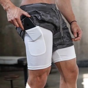 Detail of grey camo double-layer shorts featuring a hidden inner phone pocket for workouts