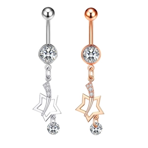 Detail of silver and rose gold belly rings with hollow star pendants and sparkling zircons
