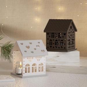 House shaped tea light candle holder set with heart cutout on marble display