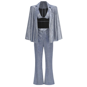 Detailed texture of women's metallic sequin blazer, halter top and straight pants set