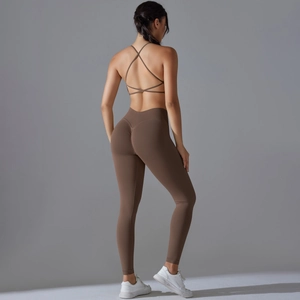Detail of brown yoga set featuring a cross-back sports bra and scrunch butt leggings