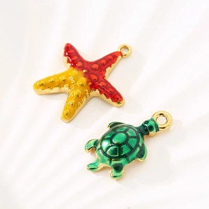 Marine starfish and sea turtle charms in gold stainless steel with colorful enamel