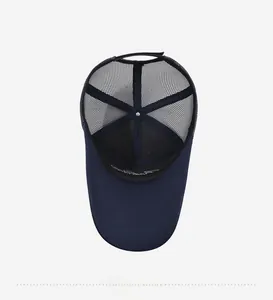 Detail view of the breathable mesh interior and sweatband of the navy blue baseball cap